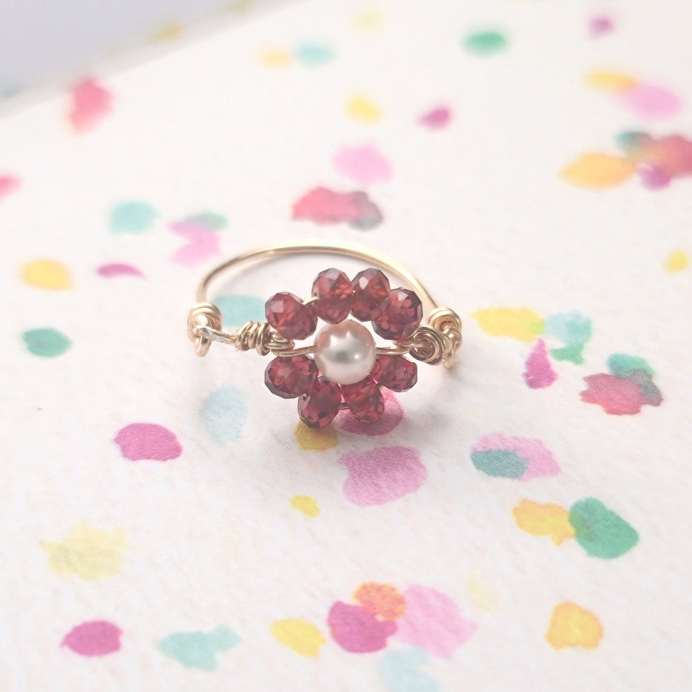 
                      
                        Garnet Pearl Ring
                      
                    